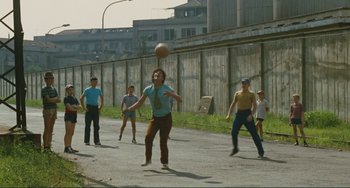 Movie still from “Oedipus Rex” (1967), directed by Pier Paolo Pasolini – A group of young men playing a game of soccer; Wide shot, High angle