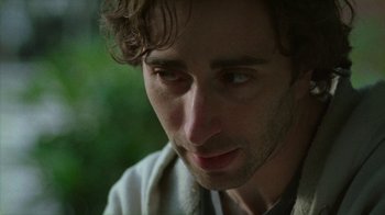 Movie still from “Old Joy” (2006), directed by Kelly Reichardt – A man's face in a forest; Close Up shot, Low angle