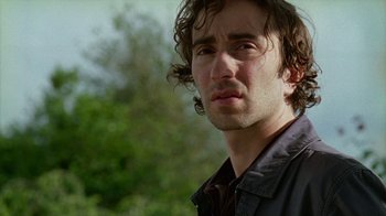Movie still from “Old Joy” (2006), directed by Kelly Reichardt – A person wearing a shirt and tie; Close Up shot, Low angle
