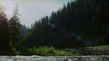 Movie still from “Old Joy” (2006), directed by Kelly Reichardt – A view of a river and a forest from a boat; Extreme Wide shot, Low angle