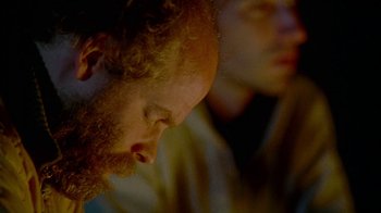 Movie still from “Old Joy” (2006), directed by Kelly Reichardt – A person with a beard; Close Up shot, Over the shoulder angle