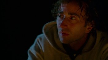 Movie still from “Old Joy” (2006), directed by Kelly Reichardt – A person looking at the camera; Close Up shot, High angle