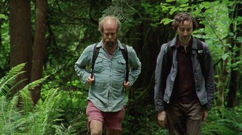 Movie still from “Old Joy” (2006), directed by Kelly Reichardt – Two men are walking through the woods together; Medium shot, Low angle