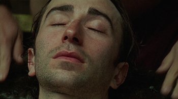 Movie still from “Old Joy” (2006), directed by Kelly Reichardt – A man's face with his eyes closed; Extreme Close Up shot, High angle