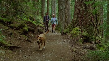 Movie still from “Old Joy” (2006), directed by Kelly Reichardt – A man and a woman walking a dog down a trail; Wide shot, Over the shoulder angle