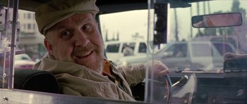 Movie still from “Old School” (2003), directed by Todd Phillips – A man with a beard is driving a car; Close Up shot, Over the shoulder angle