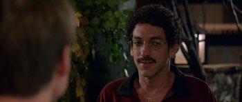 Movie still from “Old School” (2003), directed by Todd Phillips – A person wearing glasses and a red shirt; Close Up shot, Over the shoulder angle