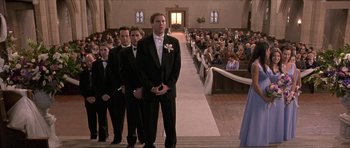 Movie still from “Old School” (2003), directed by Todd Phillips – A group of men standing in front of an audience; Wide shot, Low angle