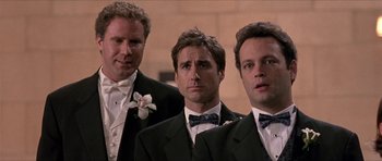 Movie still from “Old School” (2003), directed by Todd Phillips – A group of men in tuxedos standing next to each other; Close Up shot, Low angle