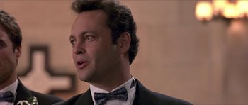 Movie still from “Old School” (2003), directed by Todd Phillips – A person wearing a suit and a bow tie; Close Up shot, Low angle