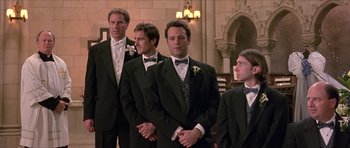 Movie still from “Old School” (2003), directed by Todd Phillips – A group of men standing next to each other in tuxedos; Medium shot, Low angle