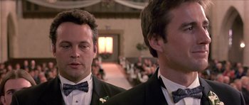 Movie still from “Old School” (2003), directed by Todd Phillips – A couple of men standing next to each other in a room; Close Up shot, Low angle