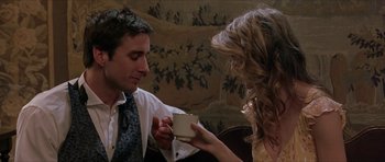 Movie still from “Old School” (2003), directed by Todd Phillips – A man and a woman holding a cup of coffee; Medium shot, Over the shoulder angle