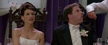 Movie still from “Old School” (2003), directed by Todd Phillips – A man and a woman sitting in front of each other in formal wear; Medium shot, Over the shoulder angle