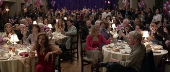 Movie still from “Old School” (2003), directed by Todd Phillips – A group of people sitting at tables in a room; Wide shot, High angle