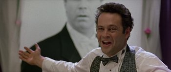 Movie still from “Old School” (2003), directed by Todd Phillips – A person wearing a suit and tie; Close Up shot, Low angle