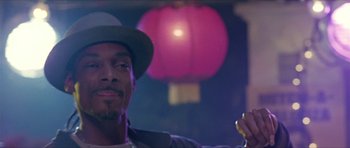 Movie still from “Old School” (2003), directed by Todd Phillips – A man in a hat is holding a cell phone; Close Up shot, Low angle