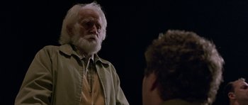 Movie still from “Old School” (2003), directed by Todd Phillips – An old man with a beard is talking to a young man; Medium shot, Over the shoulder angle