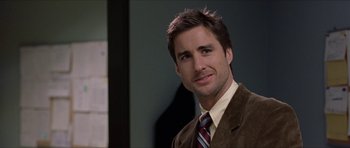 Movie still from “Old School” (2003), directed by Todd Phillips – A person wearing a suit and tie; Close Up shot, Over the shoulder angle