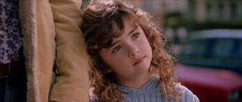Movie still from “Old School” (2003), directed by Todd Phillips – A young girl with long curly hair; Close Up shot, Low angle