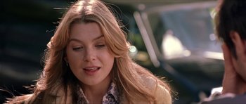 Movie still from “Old School” (2003), directed by Todd Phillips – A person with long blonde hair; Close Up shot, Over the shoulder angle