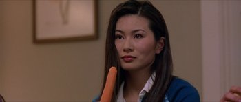 Movie still from “Old School” (2003), directed by Todd Phillips – A person holding a carrot; Close Up shot, Over the shoulder angle