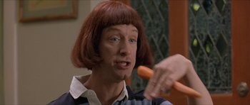 Movie still from “Old School” (2003), directed by Todd Phillips – A person with a carrot in their hand; Close Up shot, Low angle