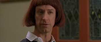 Movie still from “Old School” (2003), directed by Todd Phillips – A person wearing a wig; Close Up shot, Over the shoulder angle