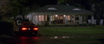 Movie still from “Old School” (2003), directed by Todd Phillips – A car parked in front of a house at night; Extreme Wide shot, High angle