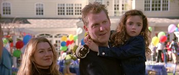 Movie still from “Old School” (2003), directed by Todd Phillips – A young man holding a stuffed animal in his arms; Close Up shot, Over the shoulder angle