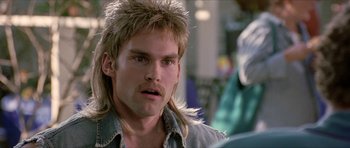 Movie still from “Old School” (2003), directed by Todd Phillips – A person with long hair; Close Up shot, Over the shoulder angle