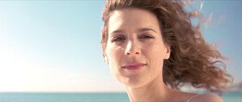 Movie still from “Old School” (2003), directed by Todd Phillips – A woman's face near the ocean; Close Up shot, Low angle