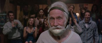 Movie still from “Old School” (2003), directed by Todd Phillips – An old man with a white beard wearing a helmet; Close Up shot, Low angle