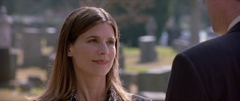 Movie still from “Old School” (2003), directed by Todd Phillips – A woman with long brown hair is looking to her left; Close Up shot, Over the shoulder angle