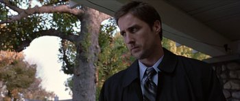 Movie still from “Old School” (2003), directed by Todd Phillips – A person wearing a suit and tie; Close Up shot, Over the shoulder angle