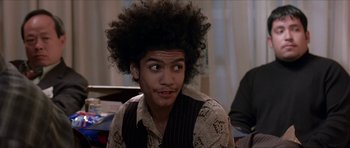 Movie still from “Old School” (2003), directed by Todd Phillips – A young man with an afro is sitting in a room; Close Up shot, Low angle