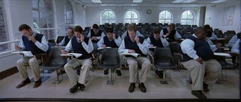 Movie still from “Old School” (2003), directed by Todd Phillips – A group of people sitting in a room reading books; Wide shot, Overhead angle