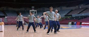 Movie still from “Old School” (2003), directed by Todd Phillips – A group of young men are practicing a dance routine; Wide shot, Low angle
