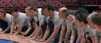 Movie still from “Old School” (2003), directed by Todd Phillips – A group of men are lined up in a row; Medium shot, Low angle