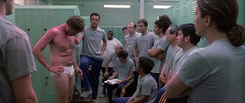 Movie still from “Old School” (2003), directed by Todd Phillips – A group of men standing in a locker room; Medium shot, Over the shoulder angle