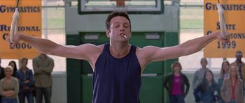 Movie still from “Old School” (2003), directed by Todd Phillips – A man with his arms stretched out holding a cigarette in his mouth; Medium shot, Low angle