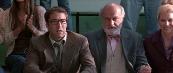 Movie still from “Old School” (2003), directed by Todd Phillips – Two men in suits and ties sitting next to each other; Close Up shot, Low angle