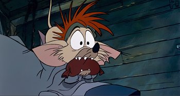 Movie still from “Oliver & Company” (1988), directed by George Scribner – A cartoon of a mouse with a red beard; Close Up shot, High angle