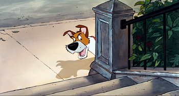 Movie still from “Oliver & Company” (1988), directed by George Scribner – A cartoon of a brown and white dog looking at the camera; Medium shot, Low angle