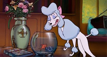 Movie still from “Oliver & Company” (1988), directed by George Scribner – A cartoon of a dog looking at a fish in a bowl; Medium shot, Over the shoulder angle