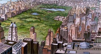 Movie still from “Oliver & Company” (1988), directed by George Scribner – An aerial view of a large city with a pond in the middle of it; Extreme Wide shot, High angle