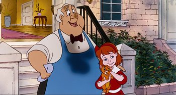 Movie still from “Oliver & Company” (1988), directed by George Scribner – A man and a woman holding a cat in front of a building; Medium shot, High angle