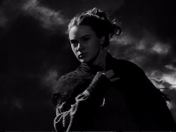 Movie still from “Oliver Twist” (1948), directed by David Lean – A black and white photo of a woman in a sweater; Close Up shot, Low angle