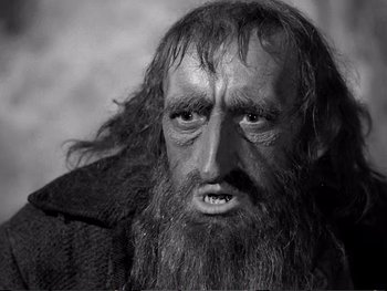 Movie still from “Oliver Twist” (1948), directed by David Lean – An old man with long hair and a long beard; Close Up shot, High angle