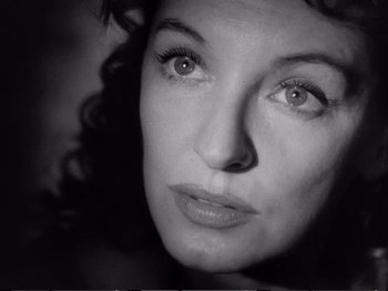 Movie still from “Oliver Twist” (1948), directed by David Lean – Black and white photograph of a woman's face; Close Up shot, Low angle